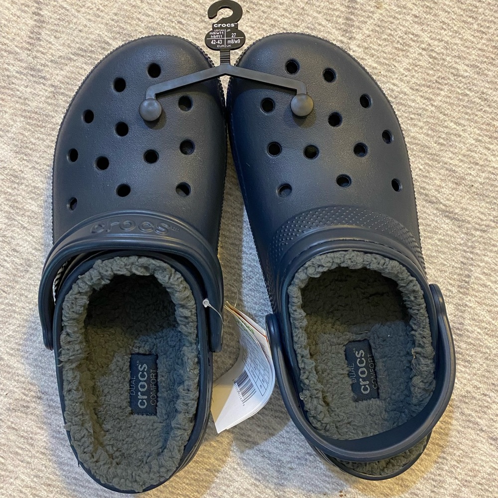 Navy lined crocs. Men’s size 9 or women’s size 11.
